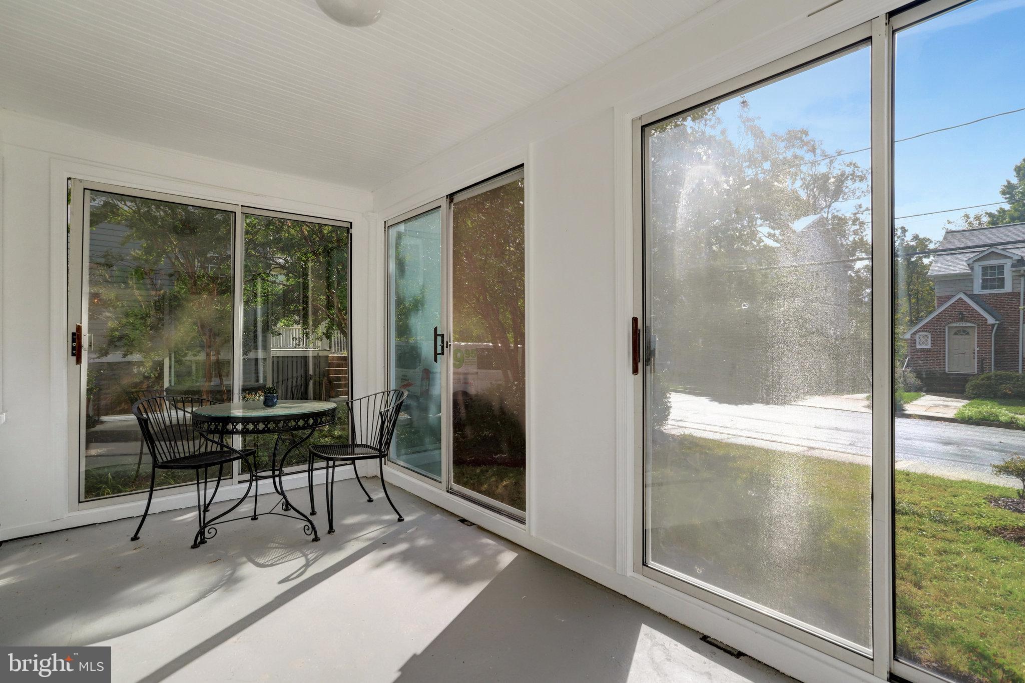 2621 2nd Road North Arlington, VA 22201 - Photo 4 of 44 a sitting area with glass door and glass door