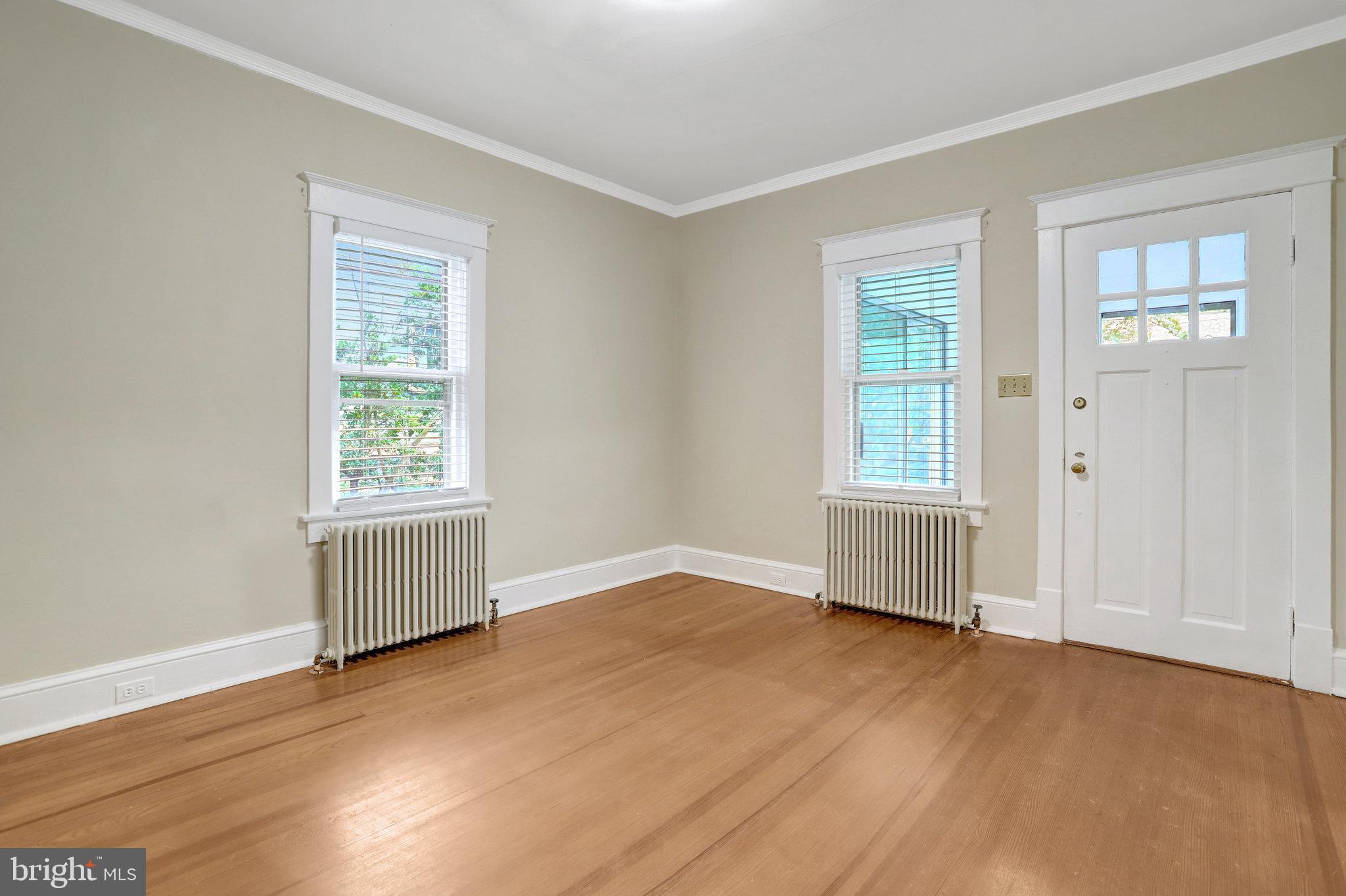2621 2nd Road North Arlington, VA 22201 - Photo 7 of 44 an empty room with wooden floor and windows