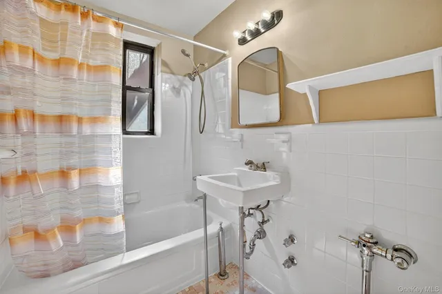 a bathroom with a sink and a bathtub