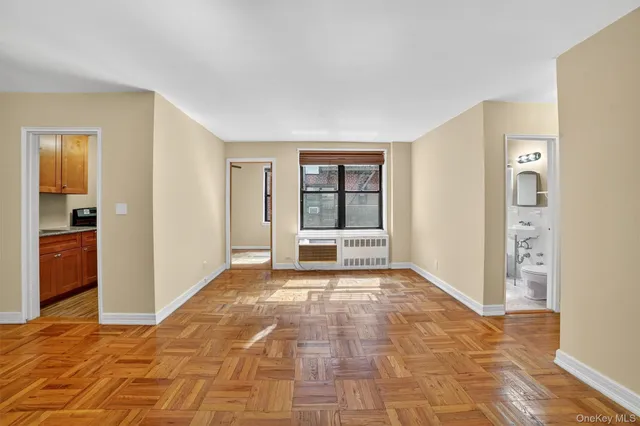 a view of an empty room with a window