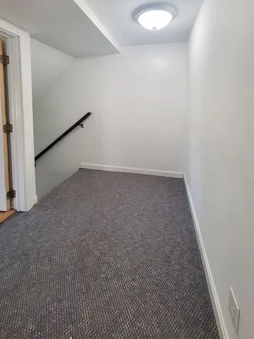 an empty room with a bench