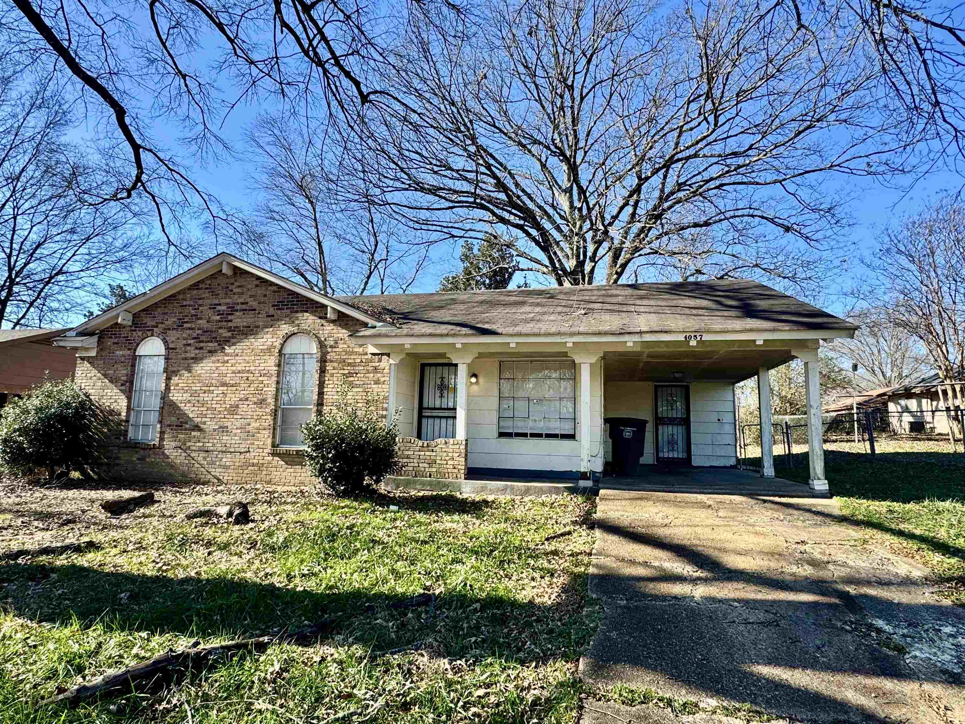 4057 Windermere Road Memphis, TN 38128 - Photo 1 of 14 a front view of house with yard