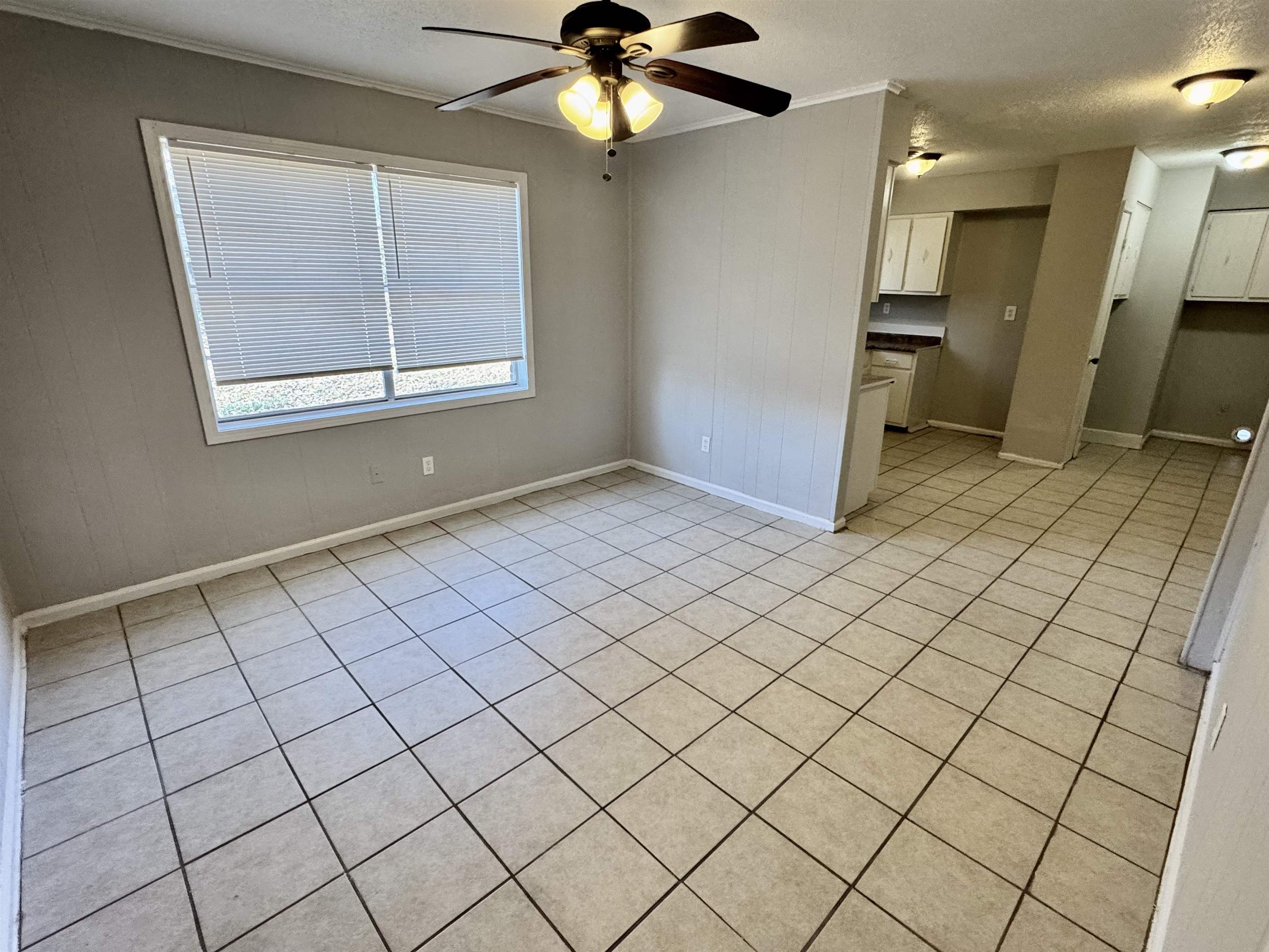 4057 Windermere Road Memphis, TN 38128 - Photo 5 of 14 a view of an empty room and a chandelier fan