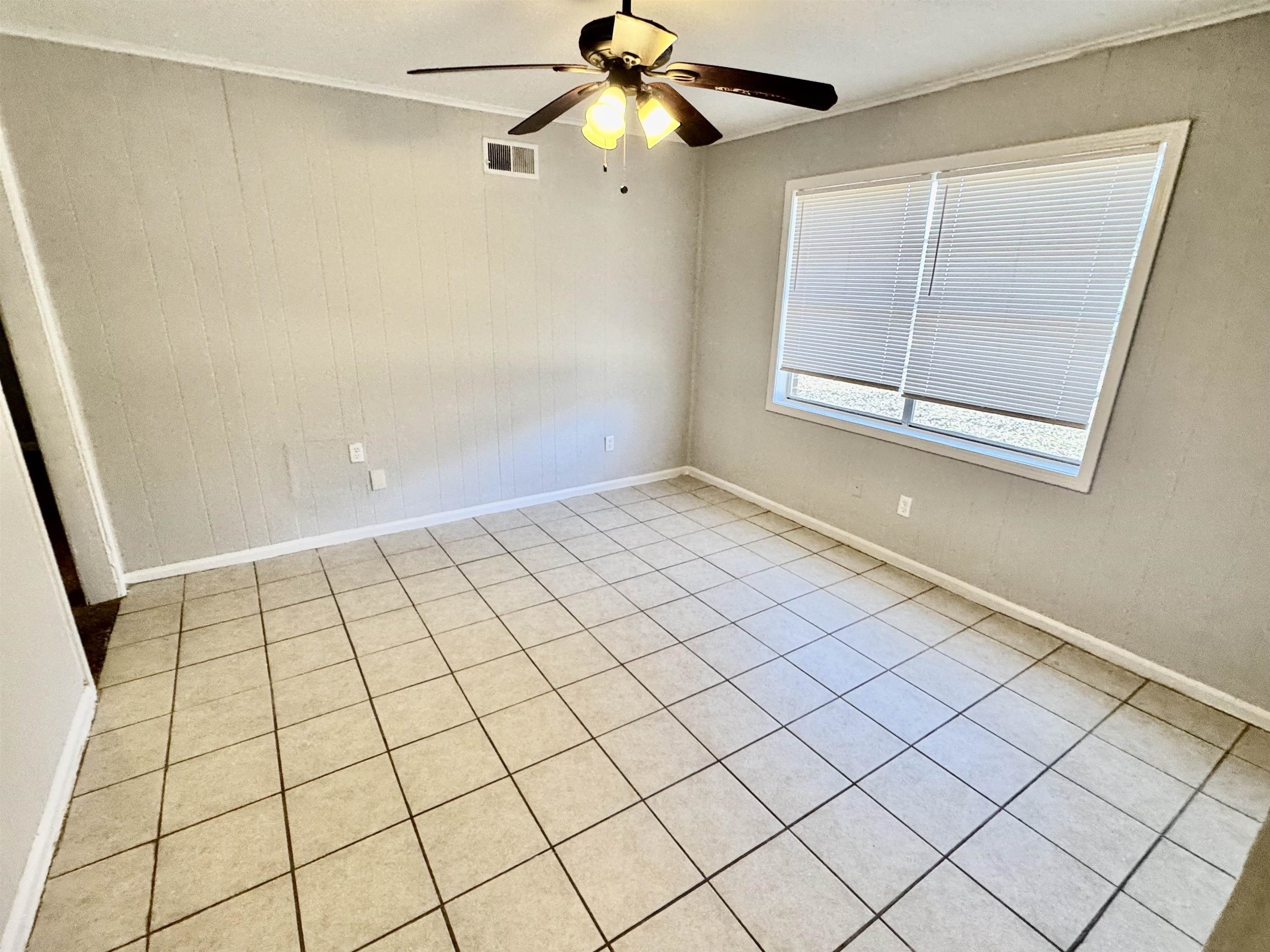4057 Windermere Road Memphis, TN 38128 - Photo 9 of 14 a view of an empty room and window