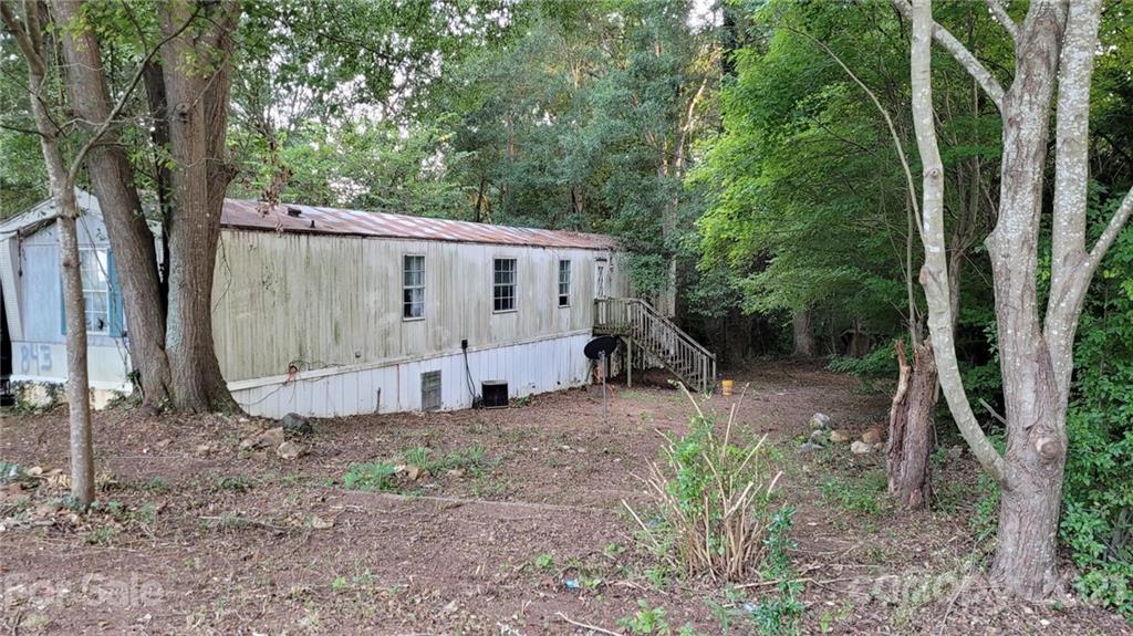 843 Archie Street Fort Mill, SC 29715 - Photo 3 of 18 a view of a barn in the middle of a yard