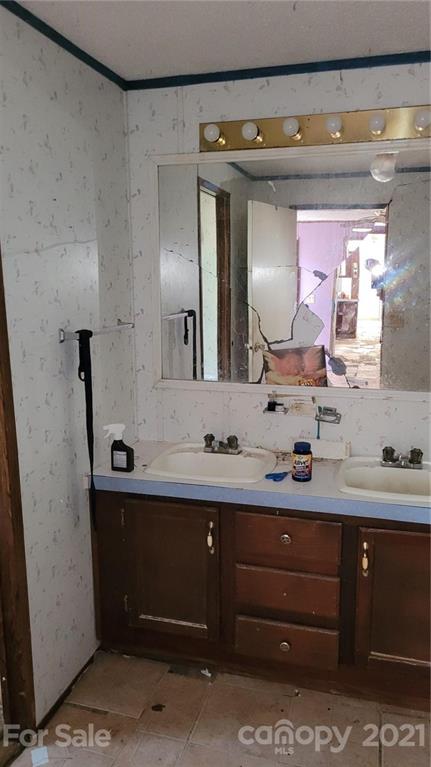 843 Archie Street Fort Mill, SC 29715 - Photo 10 of 18 a bathroom with a double vanity sink and a mirror