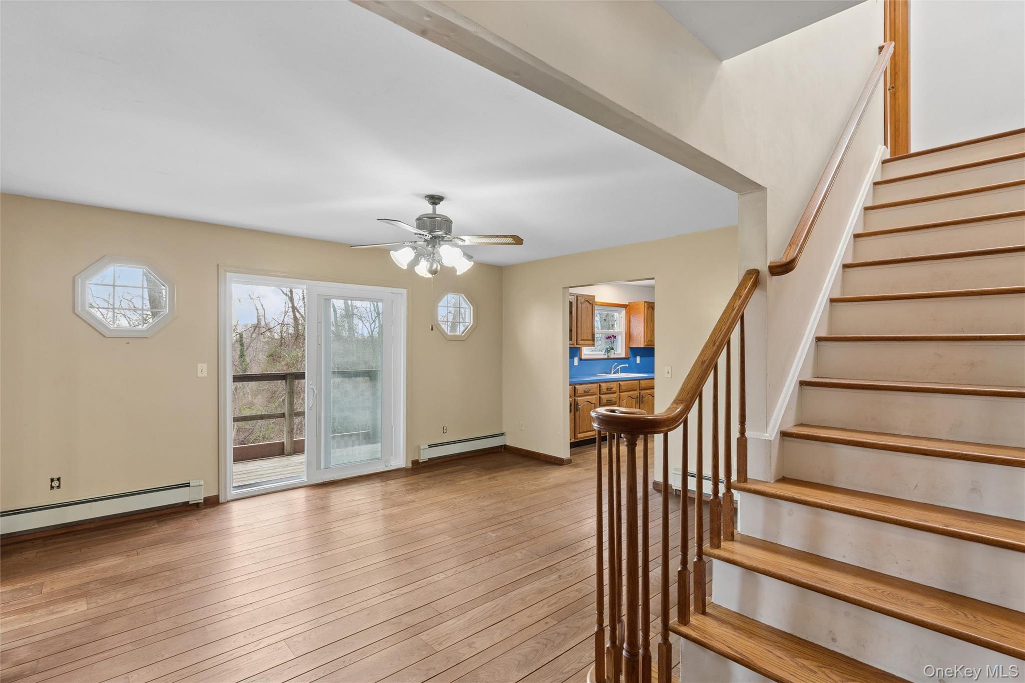49 Overhill Road Wading River, NY 11792 - Photo 4 of 27 wooden floor in an empty room with a window