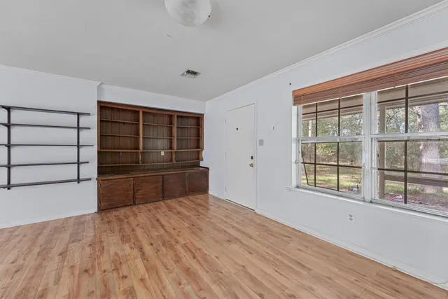 a room with a bed and a window