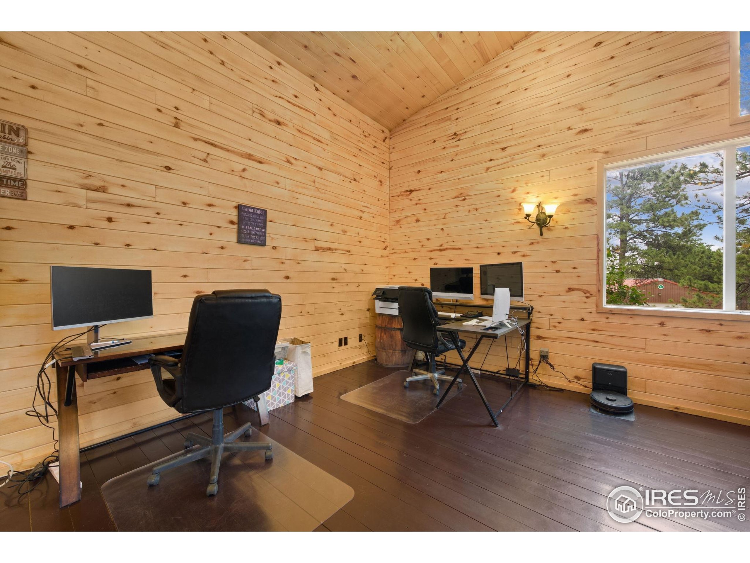 269 Cox Court Bellvue, CO 80512 - Photo 15 of 47 a view of workspace with wooden floor windows
