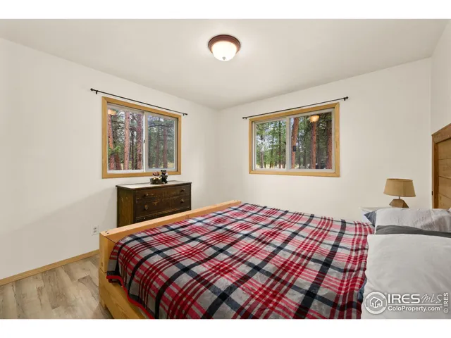 a bedroom with a bed and a table