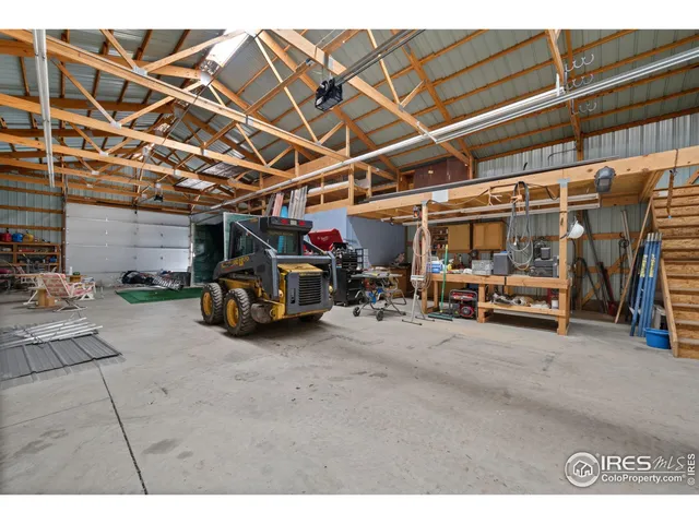 a view of parking garage with cars