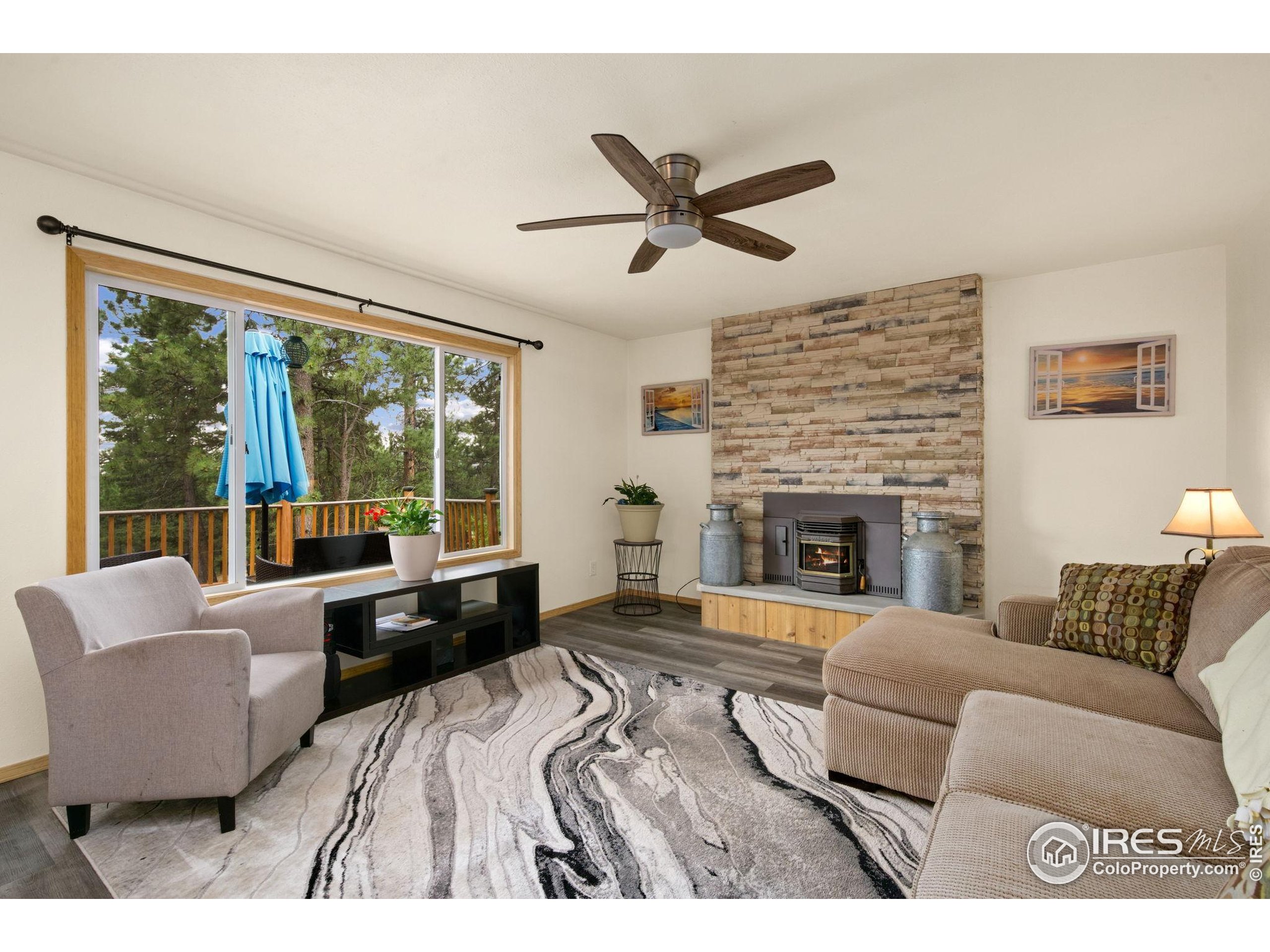 269 Cox Court Bellvue, CO 80512 - Photo 5 of 47 a bedroom with a bed and a large window