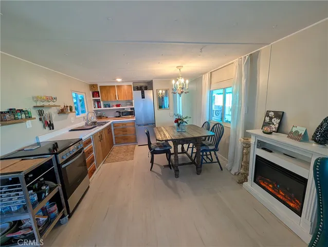 a kitchen with a table chairs and a stove