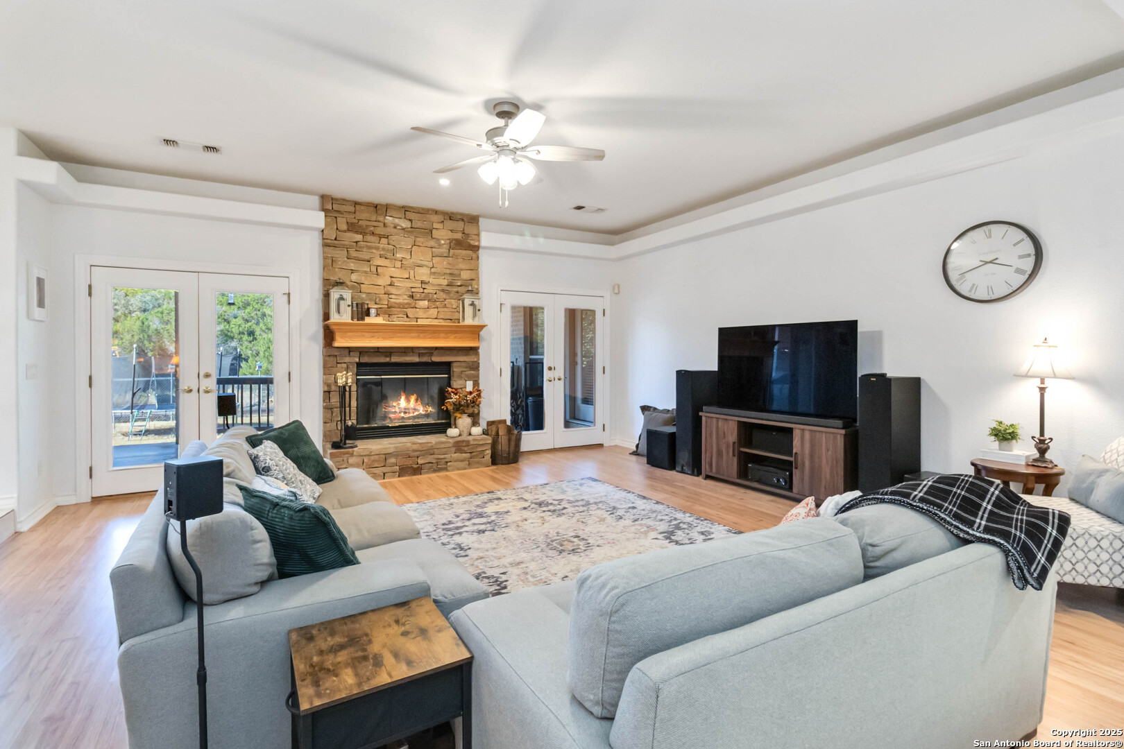 339 Long Meadow Spring Branch, TX 78070 - Photo 13 of 53 a living room with furniture a fireplace and a flat screen tv