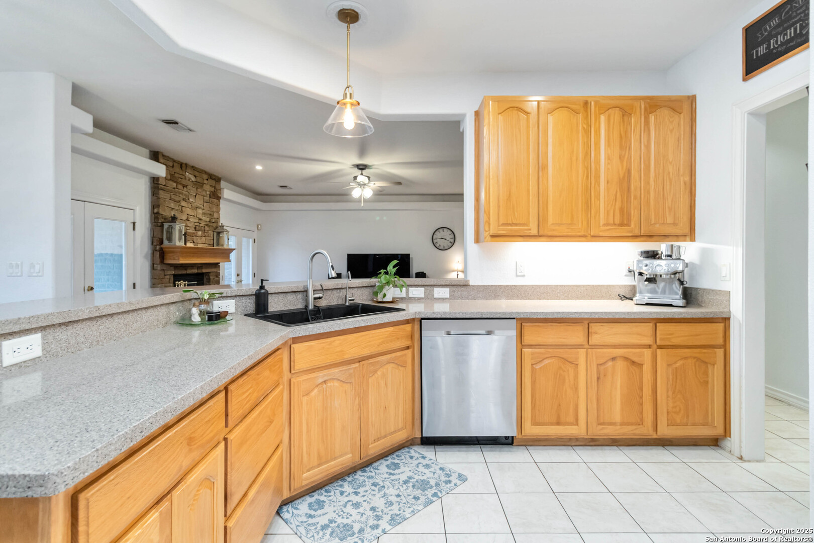 339 Long Meadow Spring Branch, TX 78070 - Photo 18 of 53 a large kitchen with kitchen island granite countertop a sink stainless steel appliances and cabinets