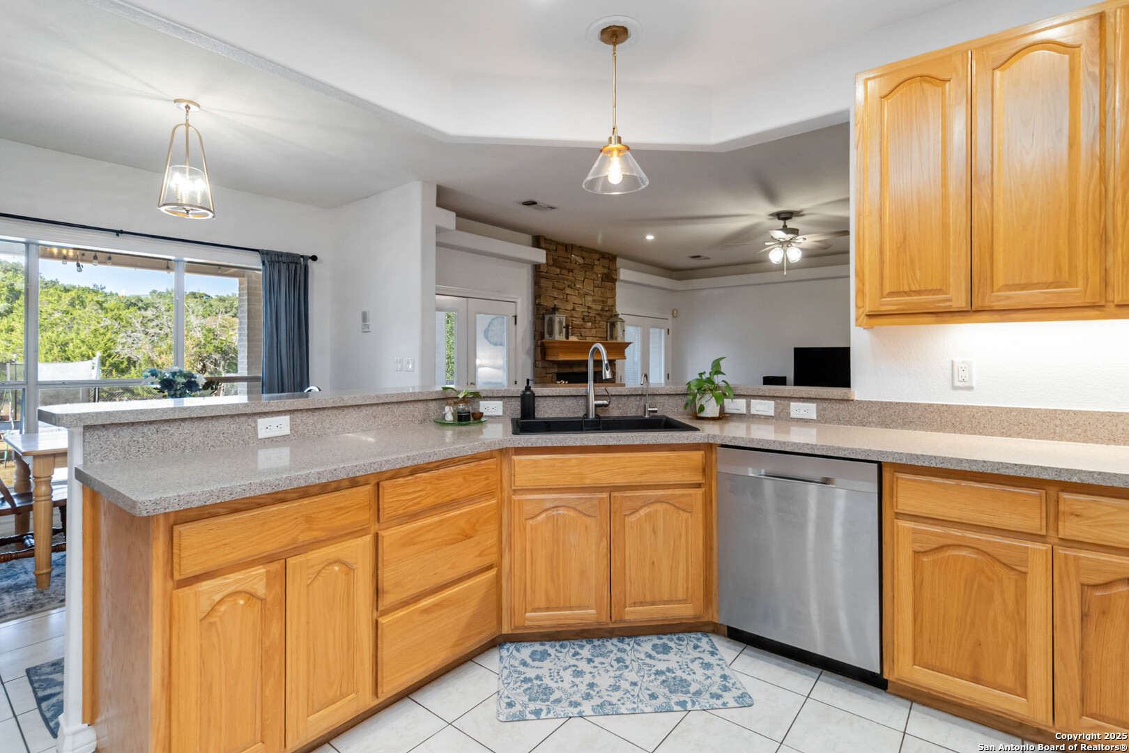 339 Long Meadow Spring Branch, TX 78070 - Photo 19 of 53 a kitchen with stainless steel appliances granite countertop a sink a stove cabinets and a window