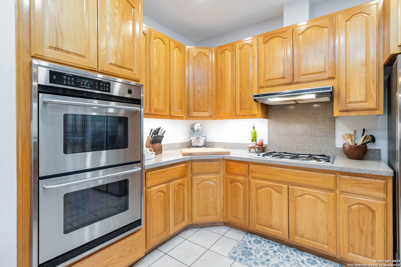 339 Long Meadow Spring Branch, TX 78070 - Photo 20 of 53 a kitchen with granite countertop a stove sink and cabinets