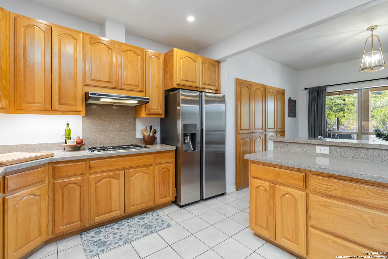 339 Long Meadow Spring Branch, TX 78070 - Photo 21 of 53 a kitchen with stainless steel appliances granite countertop a refrigerator sink and cabinets