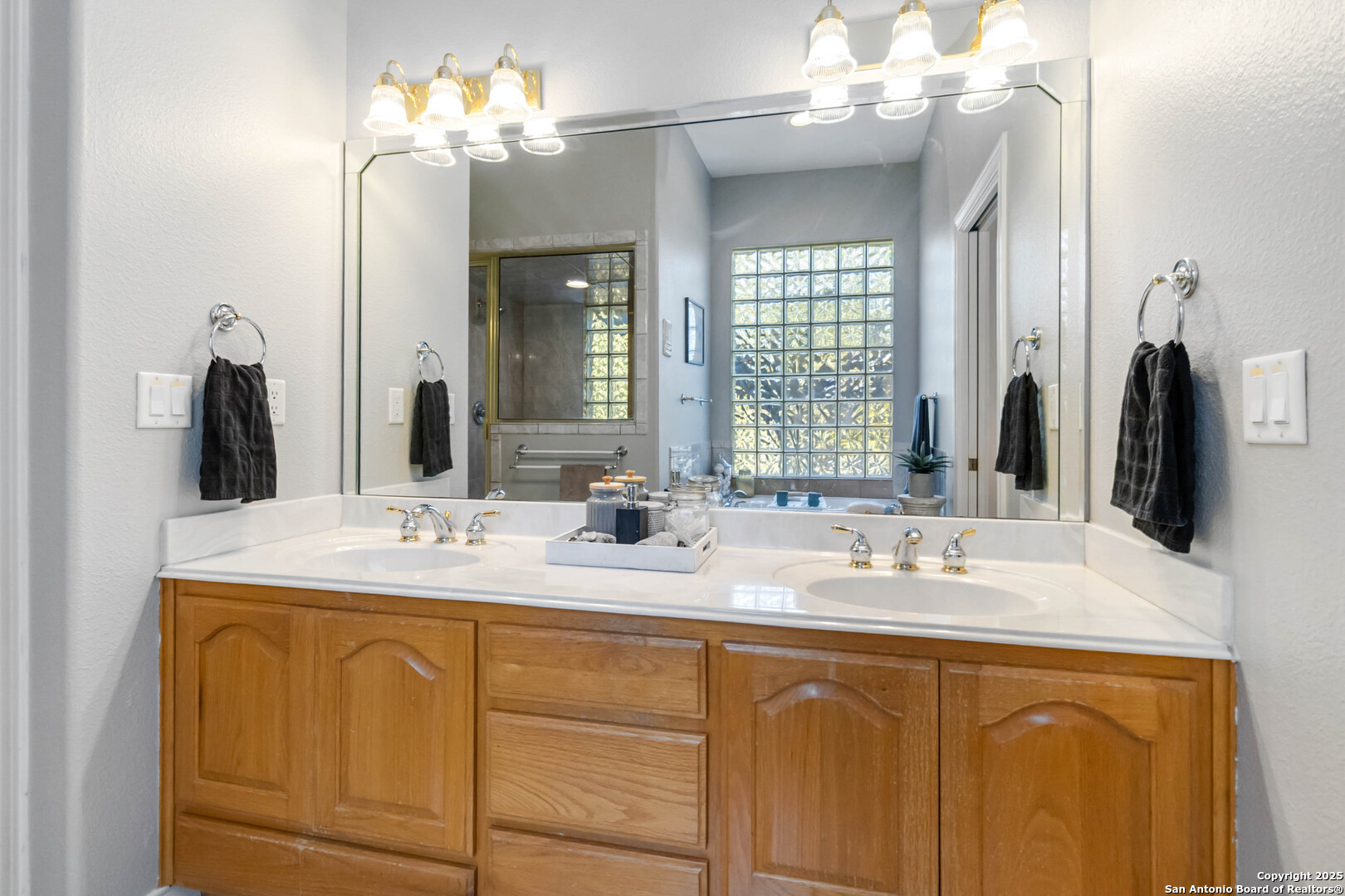 339 Long Meadow Spring Branch, TX 78070 - Photo 31 of 53 a bathroom with a double vanity sink mirror and