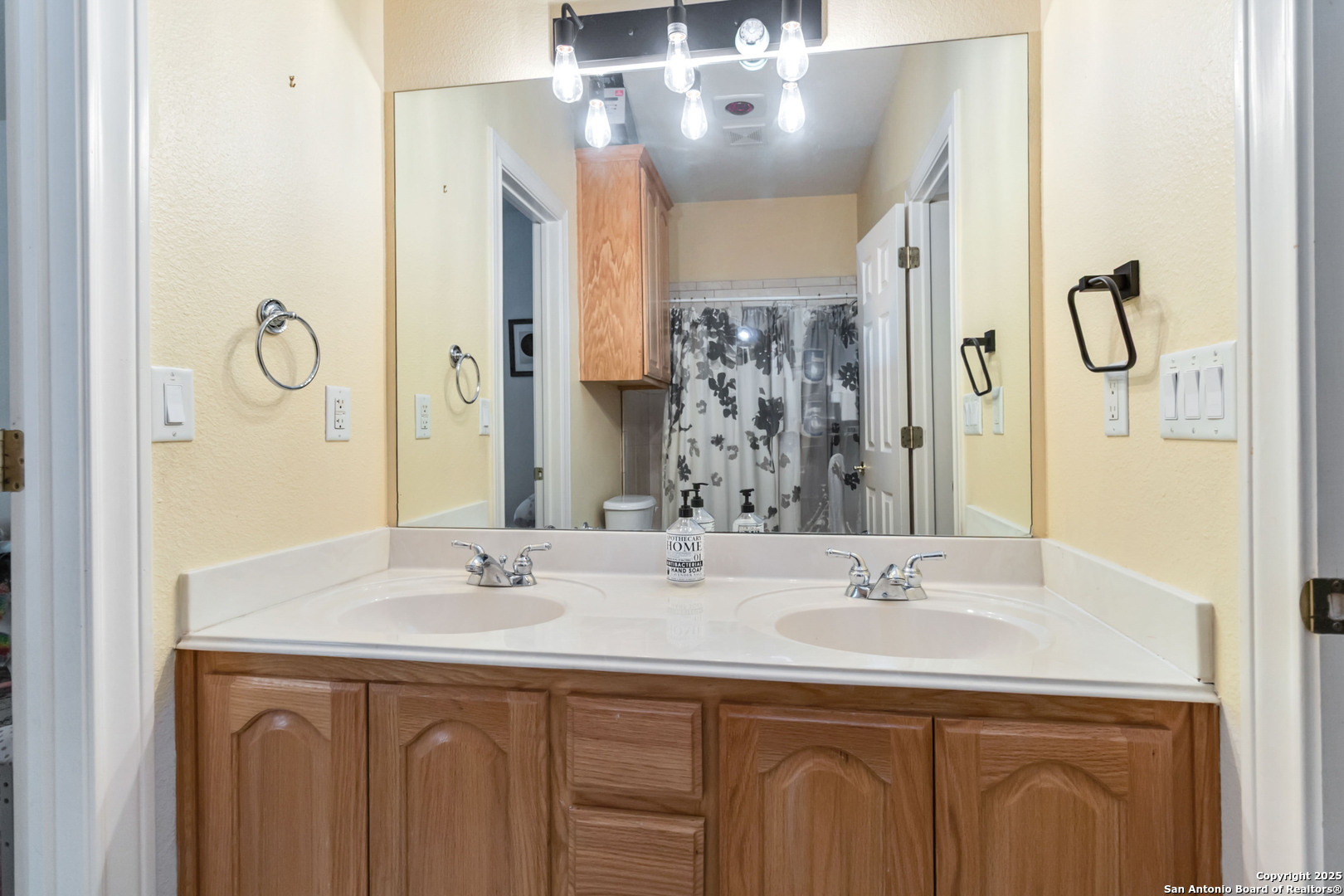 339 Long Meadow Spring Branch, TX 78070 - Photo 35 of 53 a bathroom with a sink and a mirror