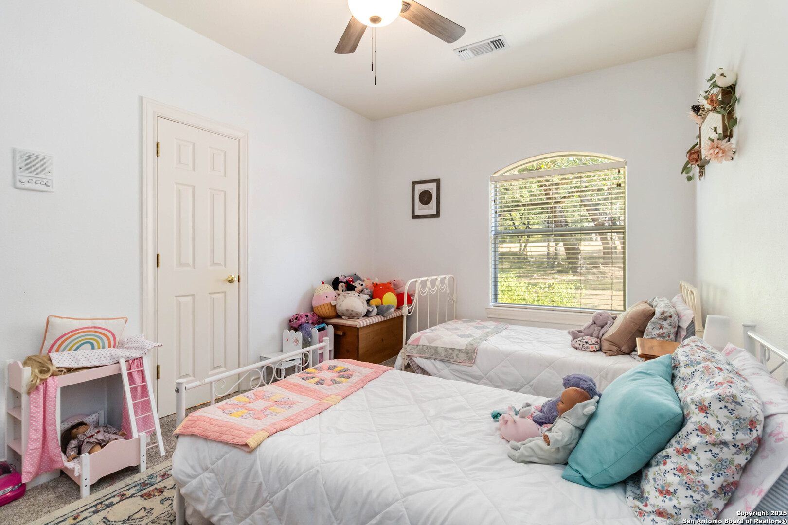 339 Long Meadow Spring Branch, TX 78070 - Photo 37 of 53 a bedroom with a bed and a chandelier