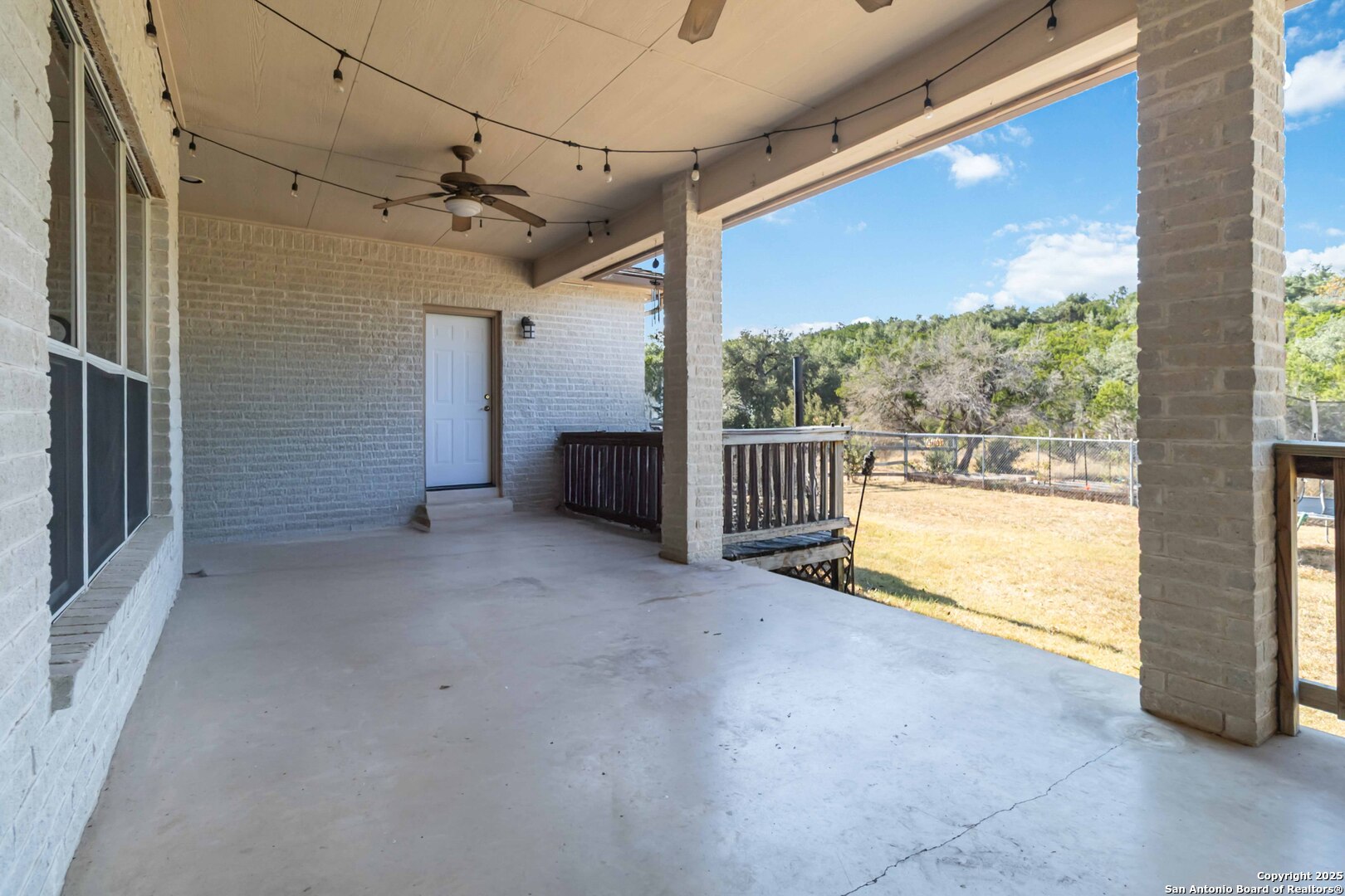 339 Long Meadow Spring Branch, TX 78070 - Photo 44 of 53 a view of a room with wooden floor and a floor to ceiling window