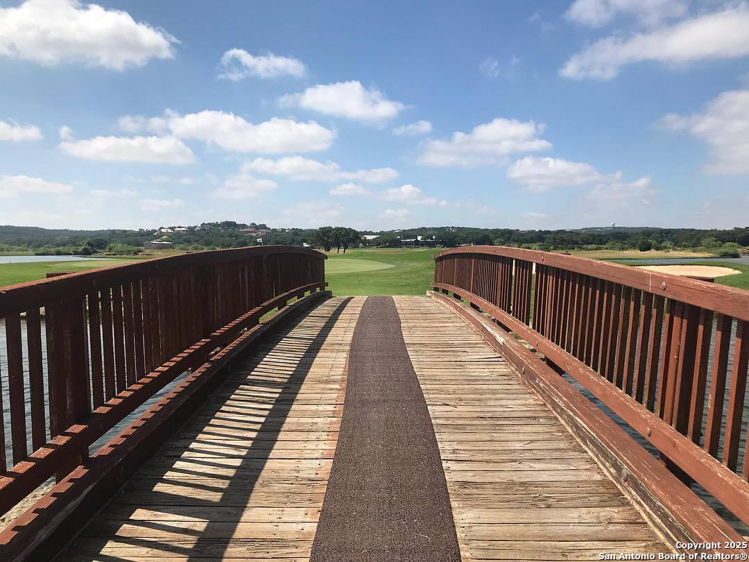 339 Long Meadow Spring Branch, TX 78070 - Photo 50 of 53 a view of wooden balcony with a lake