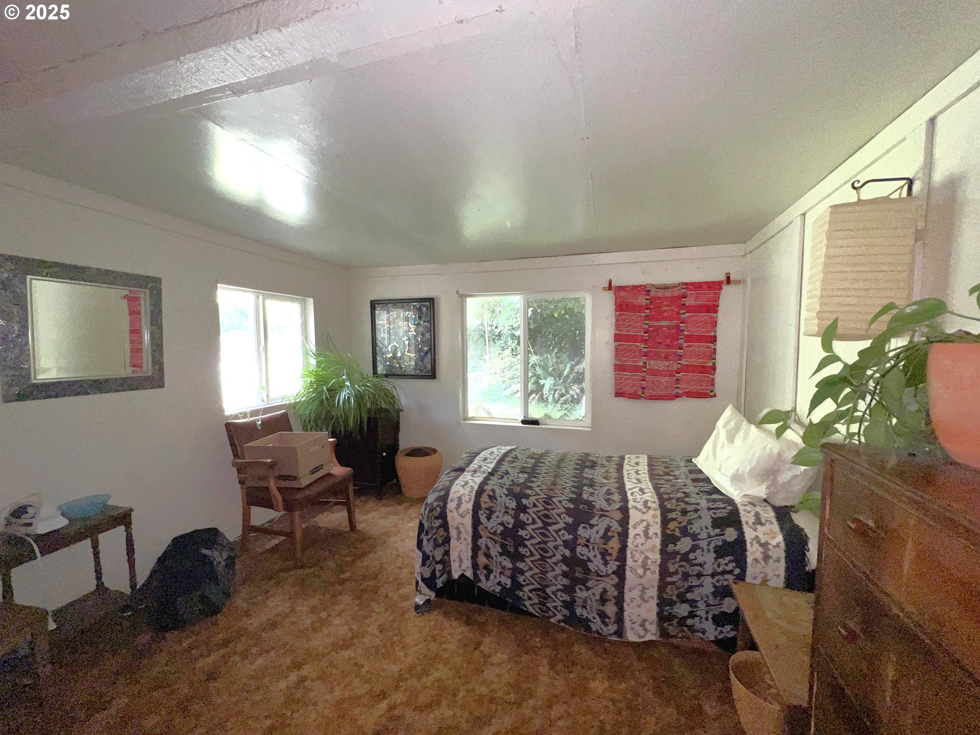 860 8th Terrace Coos Bay, OR 97420 - Photo 11 of 22 a bed room with a bed chair and a window