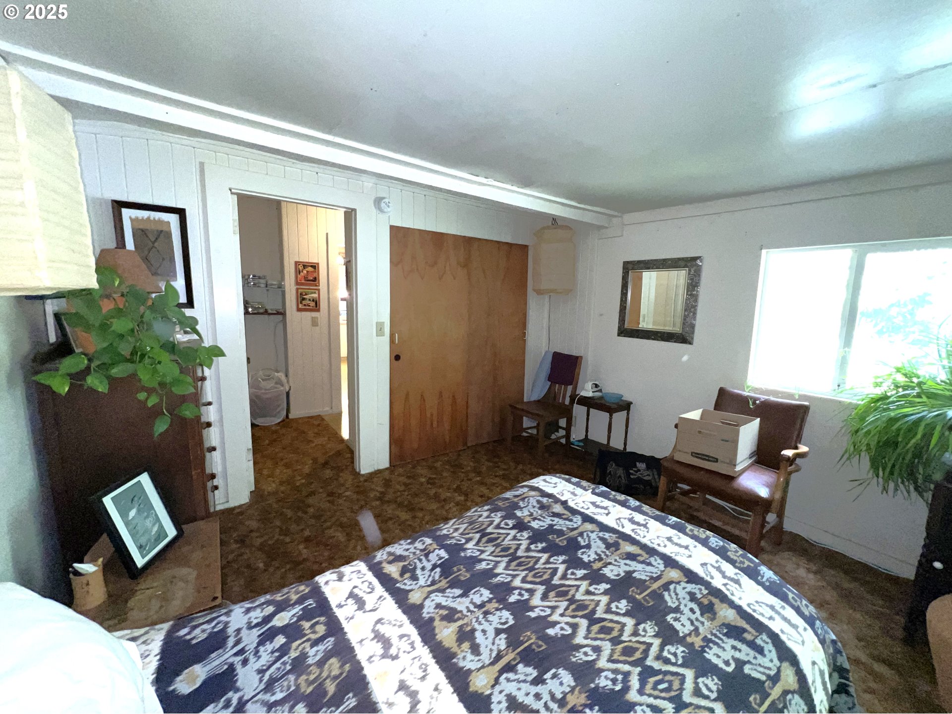 860 8th Terrace Coos Bay, OR 97420 - Photo 12 of 22 a bed room with a bed and a couch