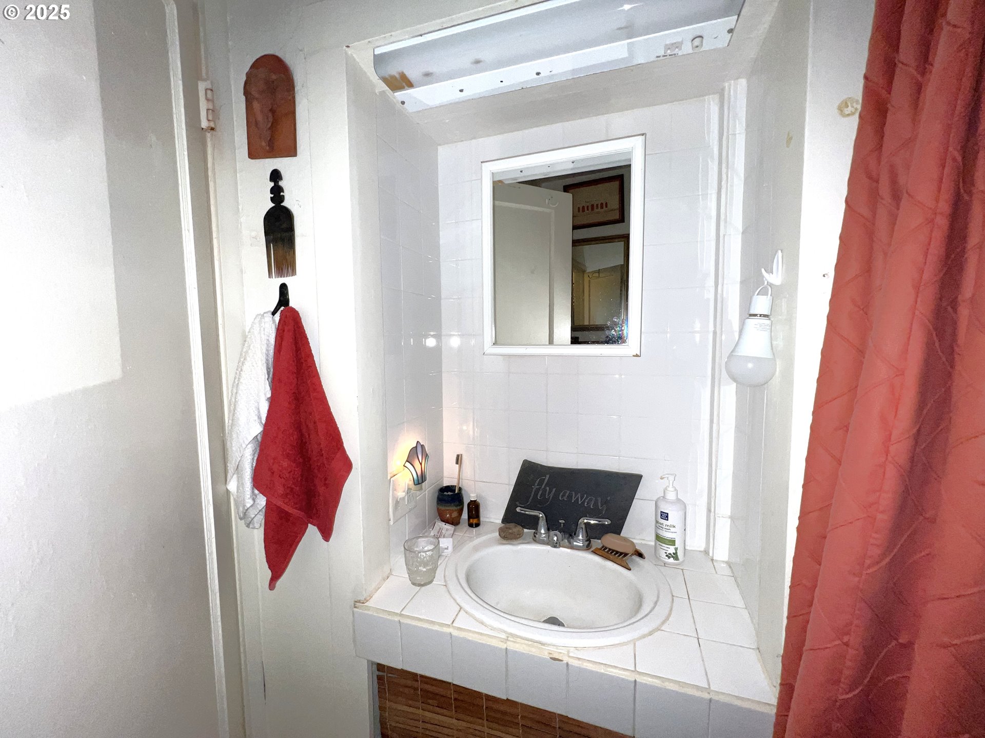 860 8th Terrace Coos Bay, OR 97420 - Photo 16 of 22 a bathroom with a sink and a mirror
