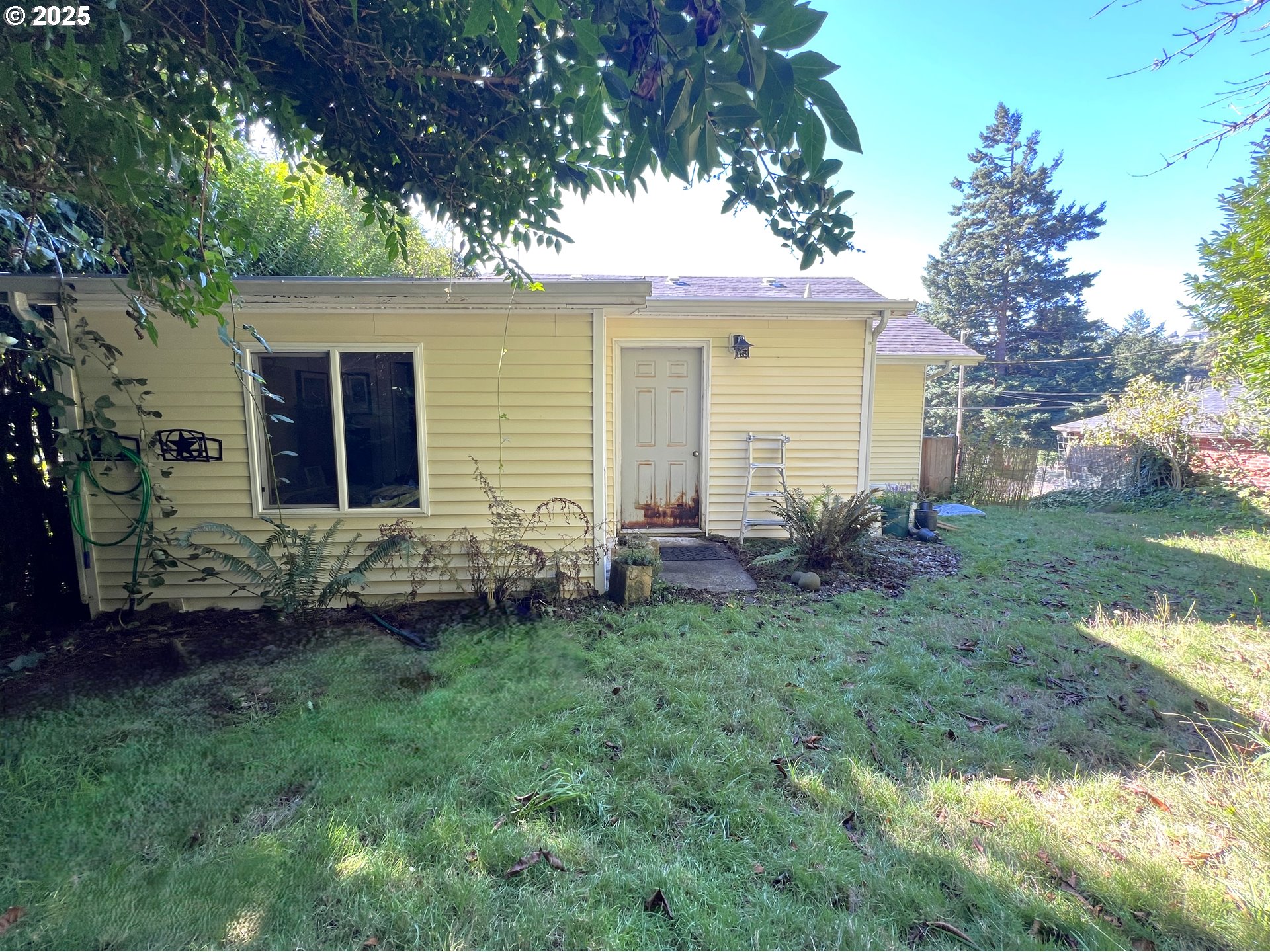 860 8th Terrace Coos Bay, OR 97420 - Photo 21 of 22 a view of a house with a backyard