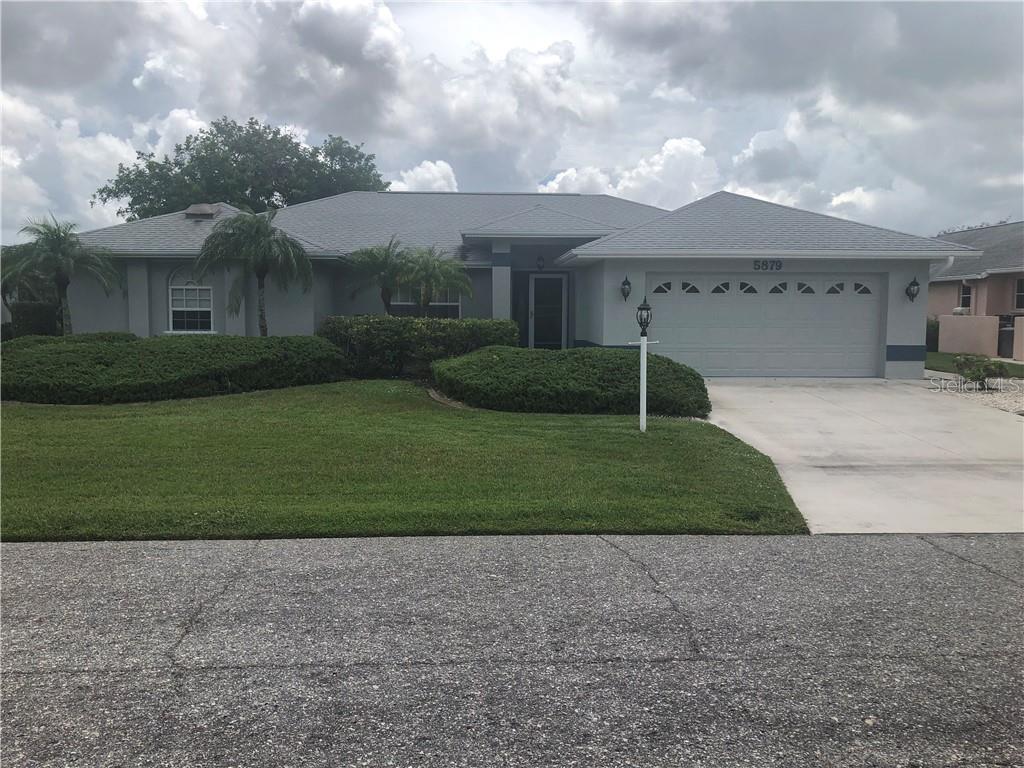 5879 Tyler Road Venice, FL 34293 - Photo 1 of 1 a house view with a garden space