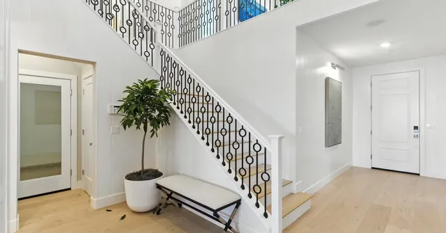 a bedroom with a bed and a mirror