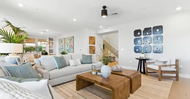 a kitchen with a white center island and cabinets