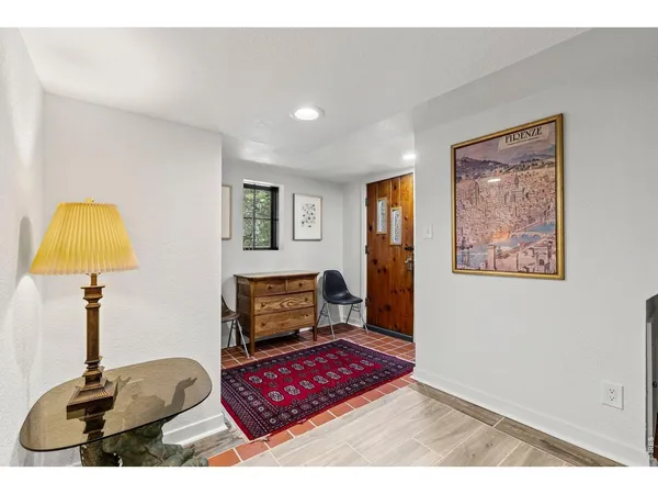 a bedroom with a bed and a lamp