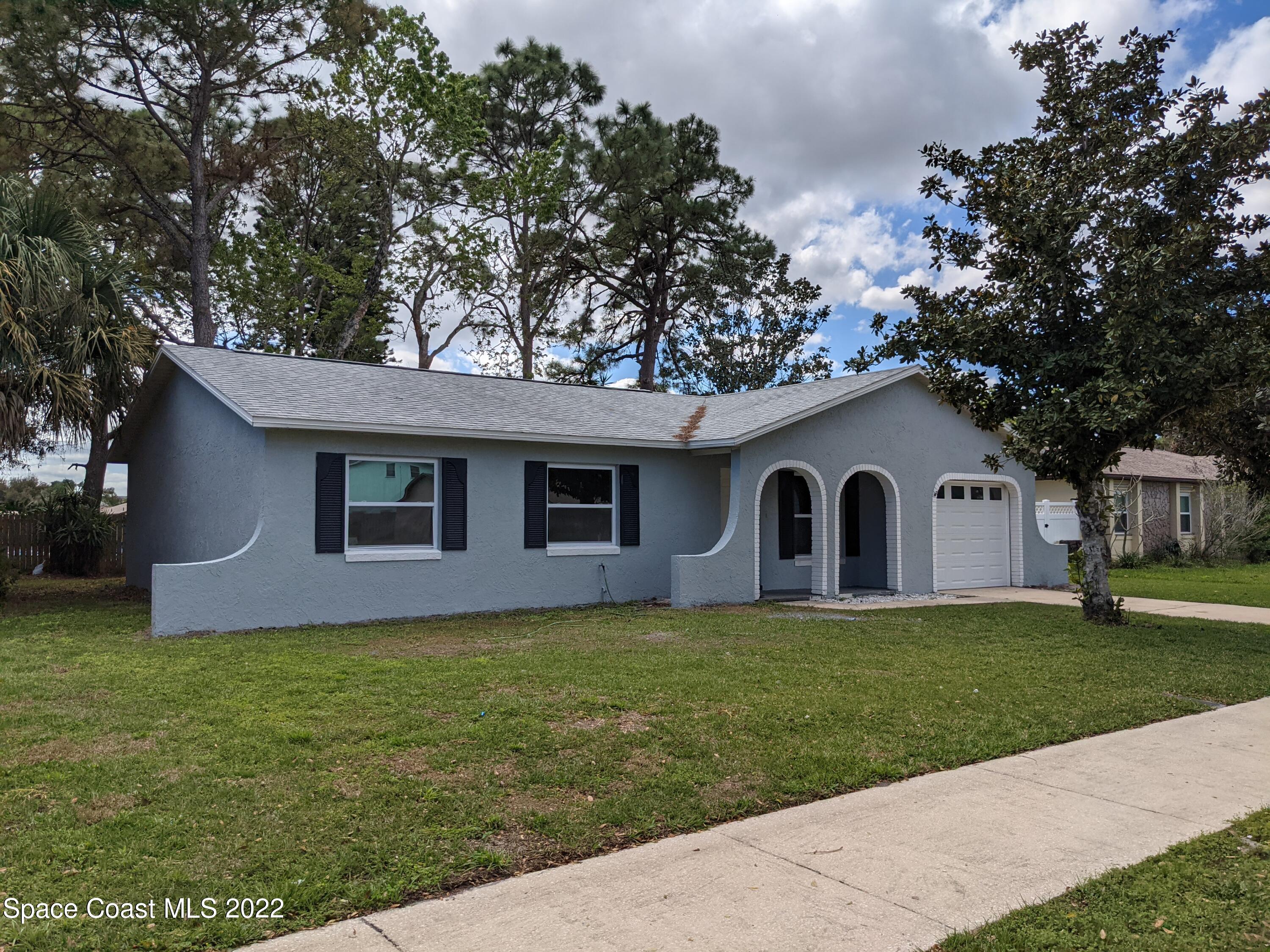 3649 Longbow Road Cocoa, FL 32926 - Photo 2 of 34 a house view with a outdoor space