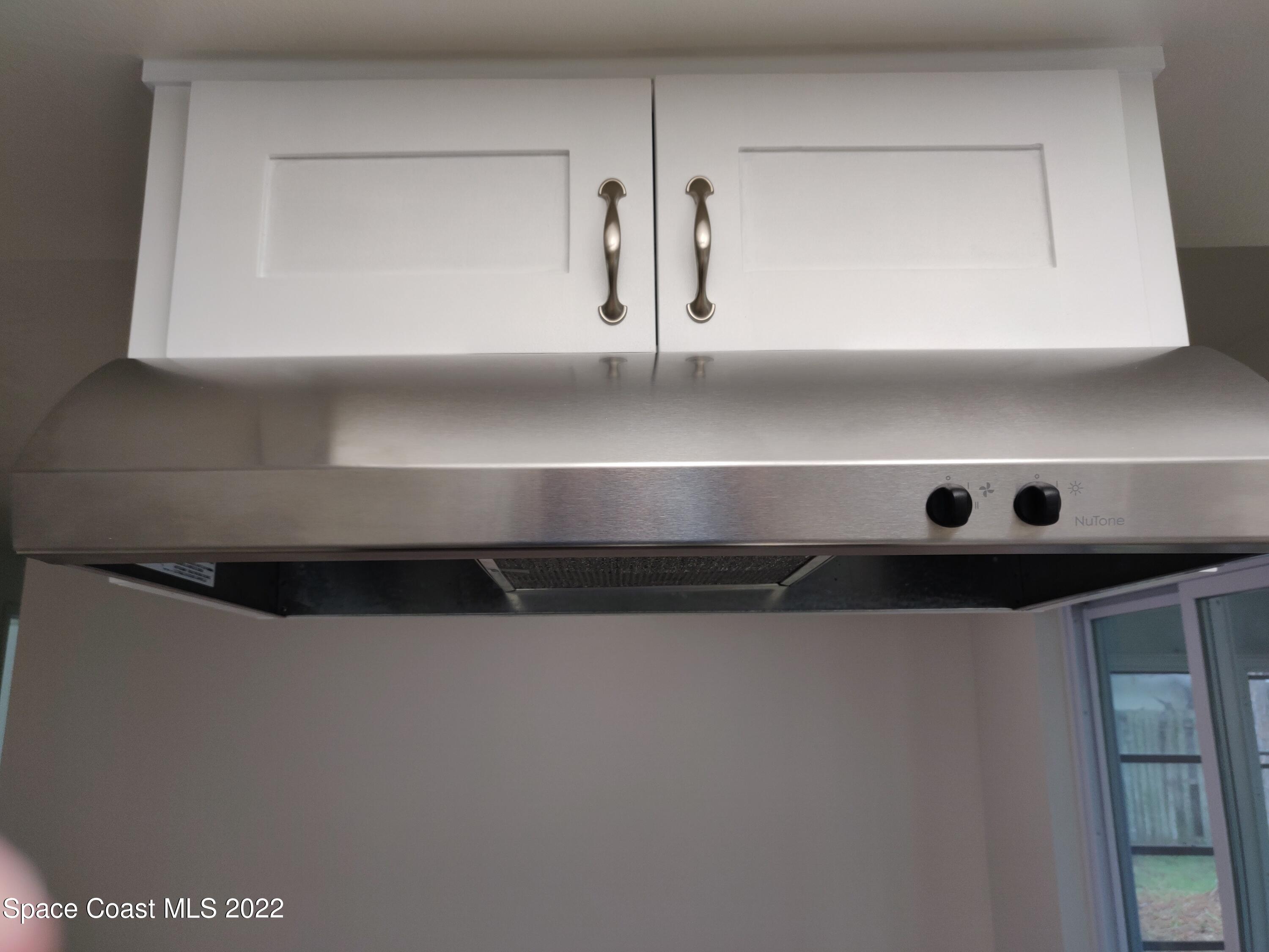 3649 Longbow Road Cocoa, FL 32926 - Photo 21 of 34 a view of rack and cabinets
