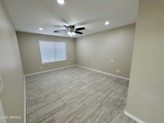 a spacious bathroom with a double vanity sink toilet and shower