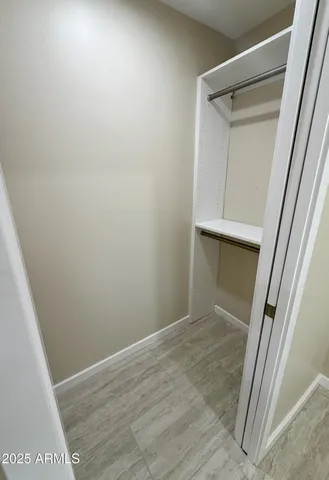 a view of a porch with wooden floor