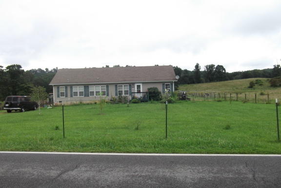 275 Conner Grove Road Southwest Willis, VA 24380 - Photo 1 of 1 a view of a big house with a big yard