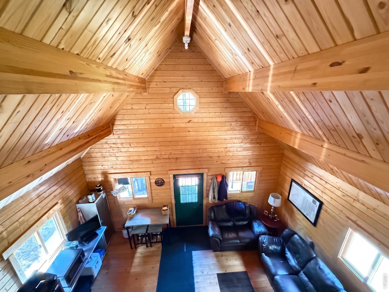 10000 Forest Road, Unit 169 Red Feather Lakes, CO 80545 - Photo 13 of 31 AI Enhanced images to help bring out the natural light brought into this cabin.