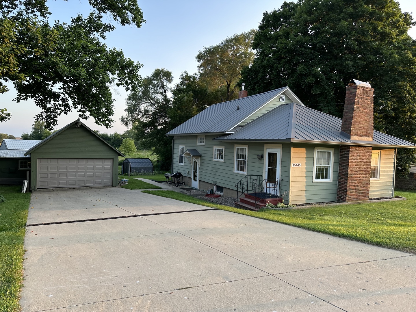 15445 Lincoln Road Morrison, IL 61270 - Photo 1 of 29 a front view of a house with a yard and trees