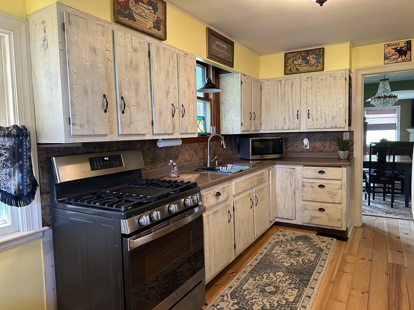 15445 Lincoln Road Morrison, IL 61270 - Photo 5 of 29 a kitchen with stainless steel appliances granite countertop a stove a sink and a refrigerator