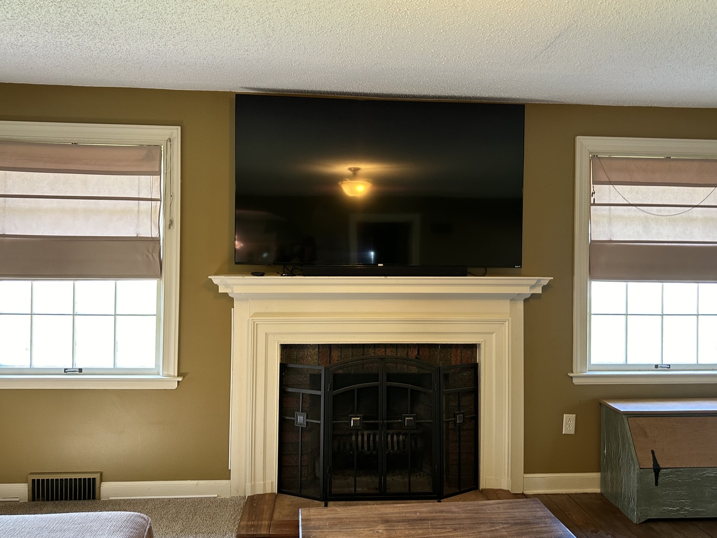 15445 Lincoln Road Morrison, IL 61270 - Photo 9 of 29 a living room with a fireplace and a flat screen tv