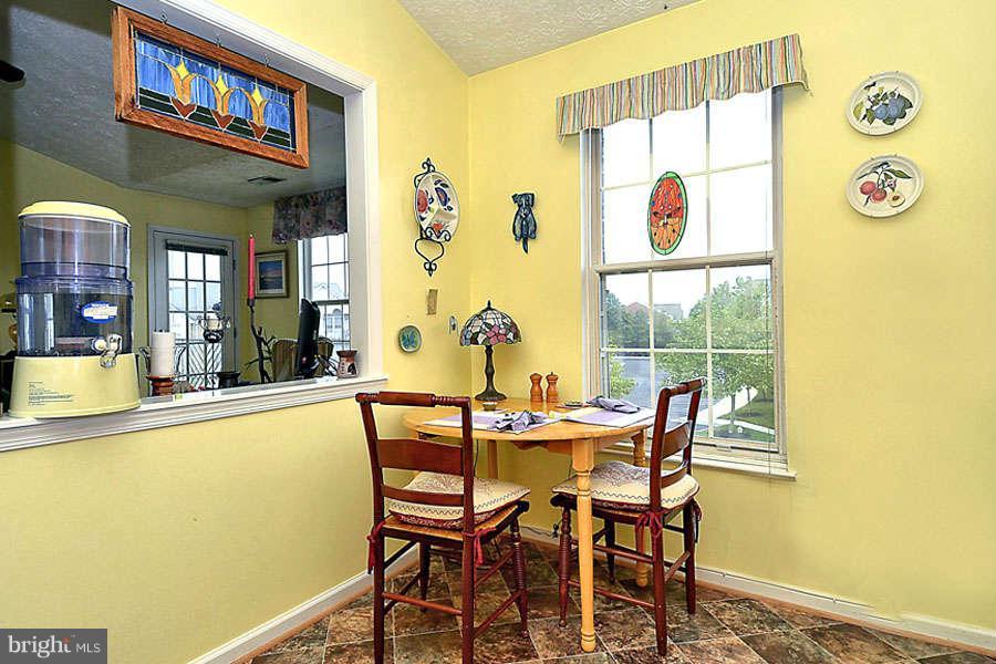 2445 Blue Spring Court, Unit 301 Odenton, MD 21113 - Photo 13 of 30 Butler's Window into Dining Area