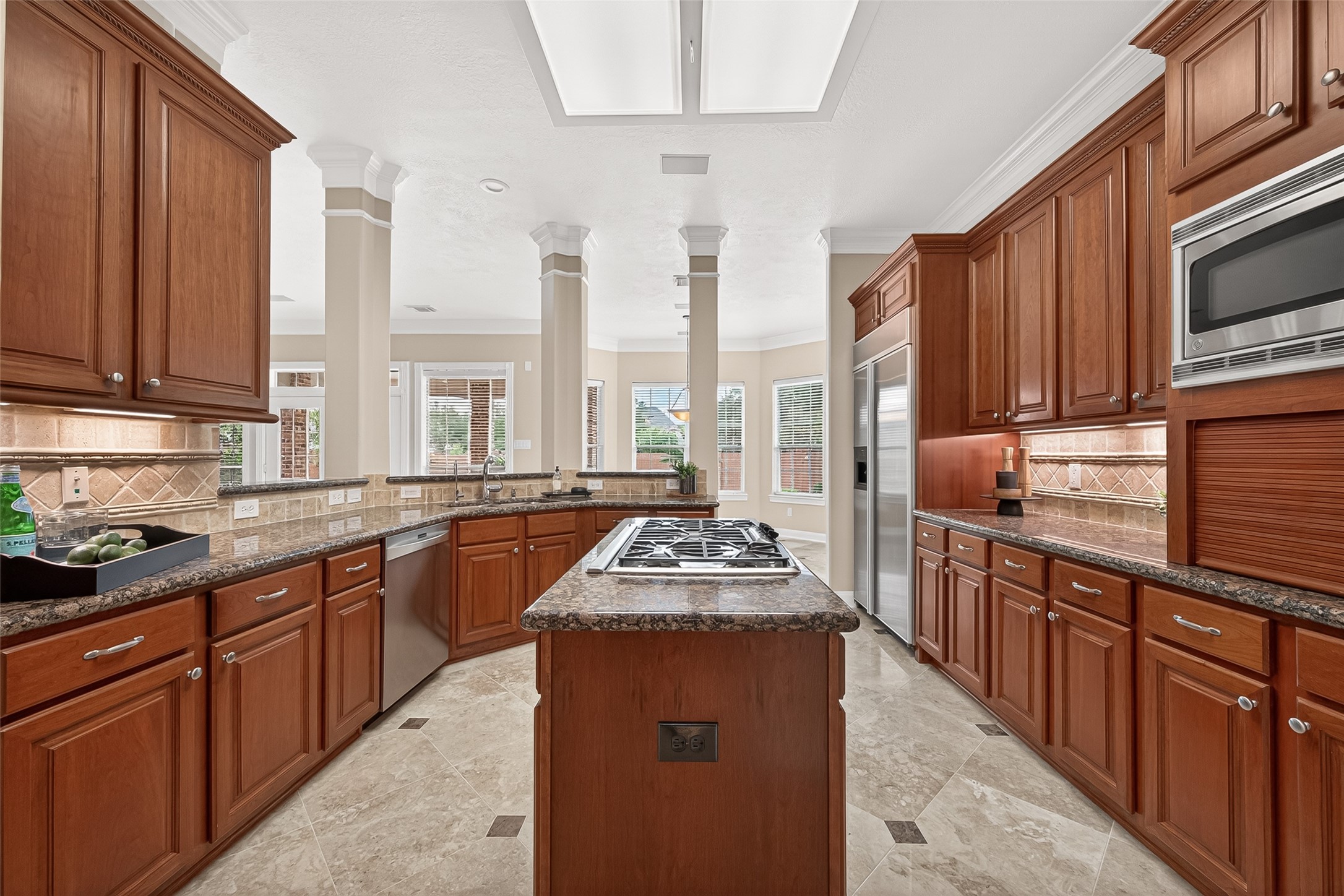 4203 Deforest Ridge Circle Katy, TX 77494 - Photo 16 of 50 The kitchen features 5-burner gas cooktop, built-in KitchenAid French door refrigerator and double KitcheAid ovens