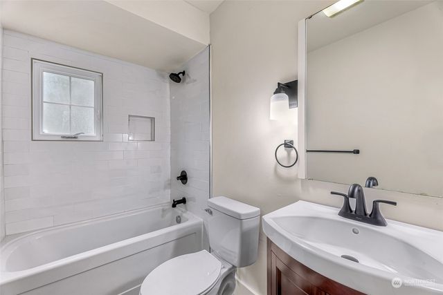 a bathroom with a sink toilet and bathtub