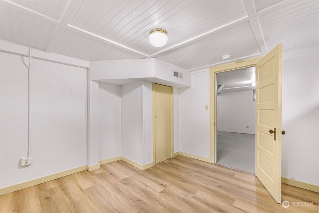 a bathroom with a shower and a glass door