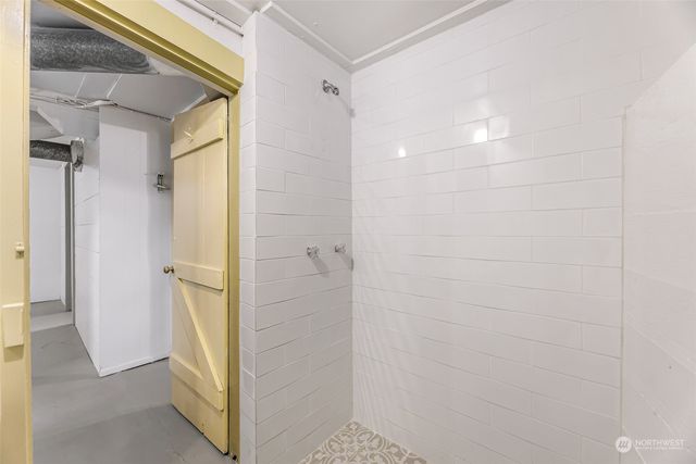 a view of a backyard with a tree