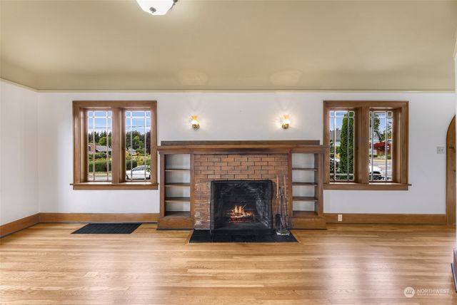 a living room with fireplace and a fireplace